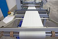 Starting up the cutting machine with precise winding of the strips.